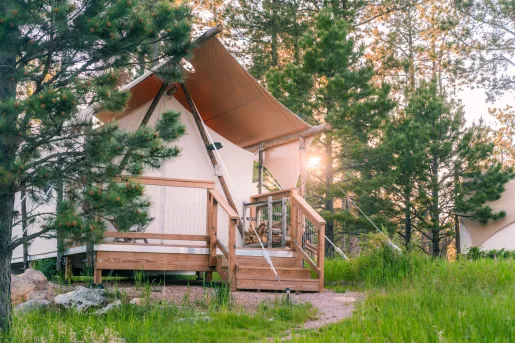 a glamping tent in the woods