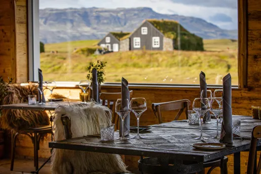 dining room with a view of a barn