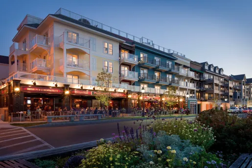 Hotel building with outdoor dining on the sidewalk