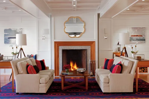 Hotel lobby with a stone fireplace and art on the walls
