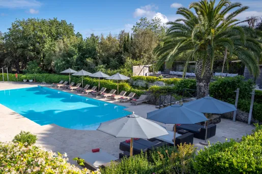 Swimming pool surrounded by lounge chairs