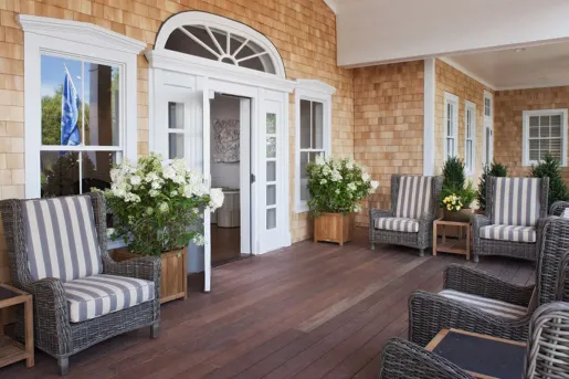 wooden deck with Adirondack chairs