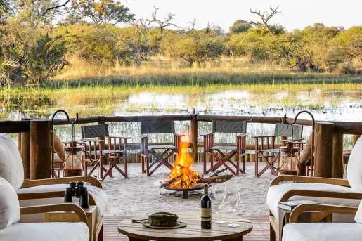 patio with firepit on a lake