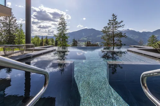 Outdoor infinity pool looking out towards the mountains