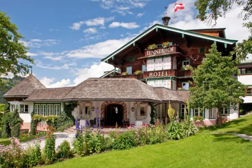 Wooden building with a grass field in front