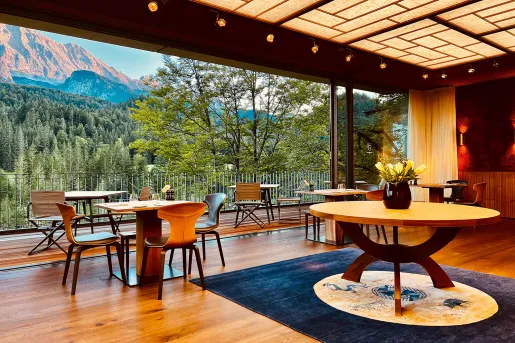 Dining room tables overlooking trees on a mountainside