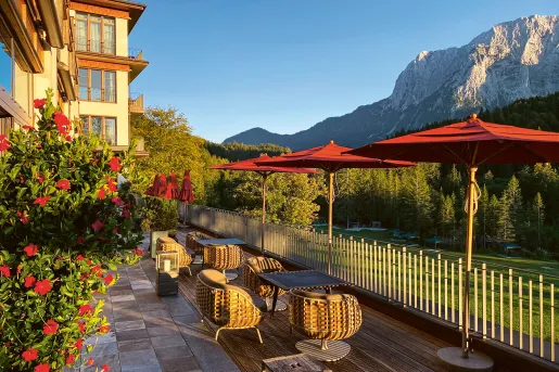 Courtyard tables and chairs overlooking a grass field