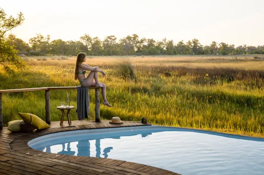 guest relaxing by the pool