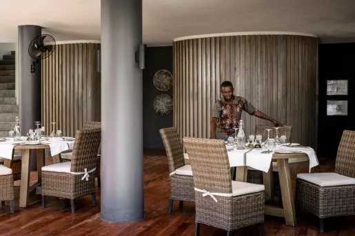 a man sets dining room table