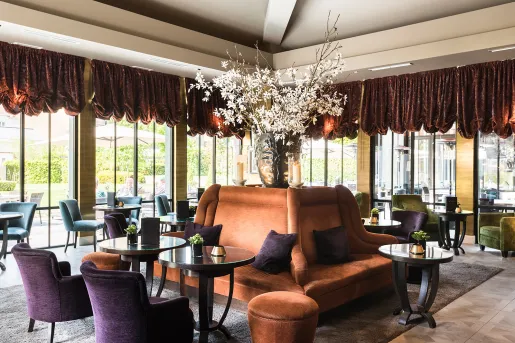 Cushioned sofa in the center of a dining hall