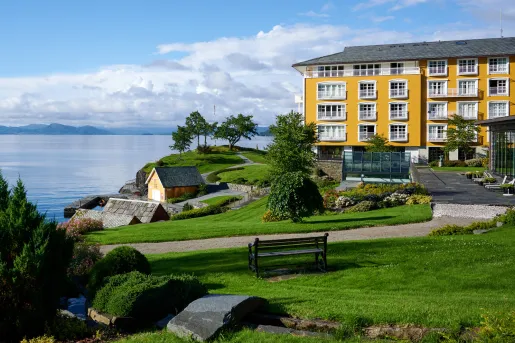 yellow house on a cliff