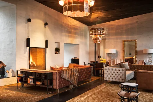 living room with big chandelier and fire place