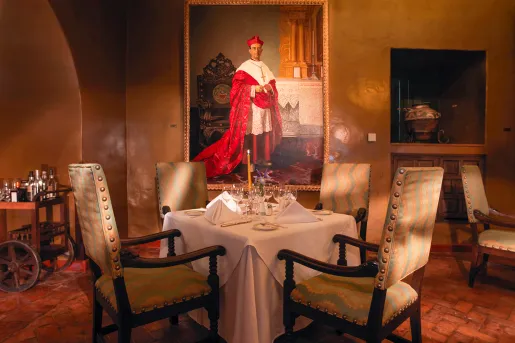 dining room table in front of portrait