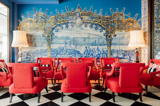red chairs in a room with blue tile backsplash