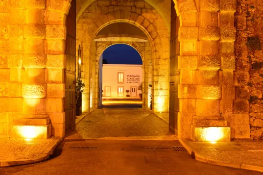 Stone archways leading to hotel entrance