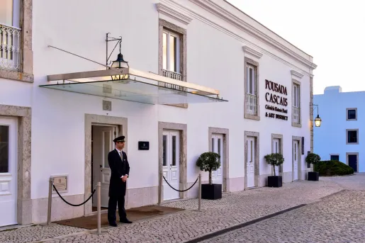 doorman outside the entrance to the citedela de cascais