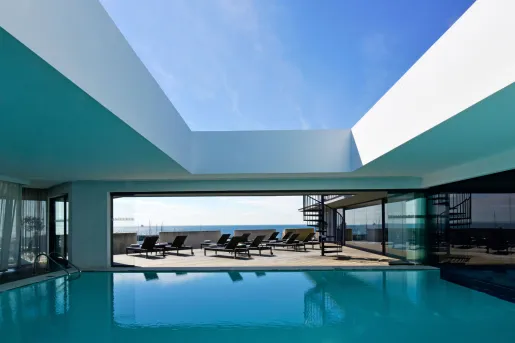 hotel pool with lounge chairs