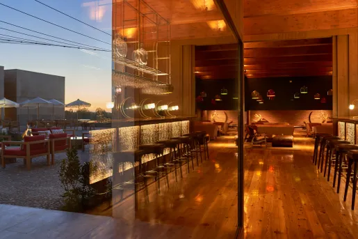 Reflection of a wine cellar and a bar and lounge to the left