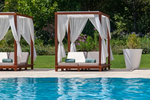 covered lounge chairs by the pool