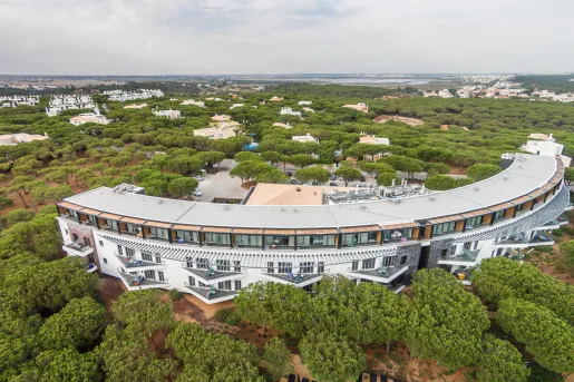 Crescent-shaped building with multiple balconies