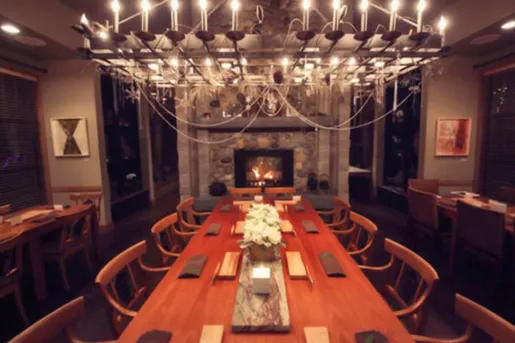 long dining room table under chandelier