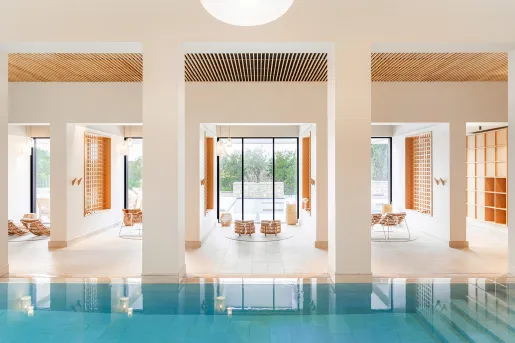 pool surrounded by tall columns