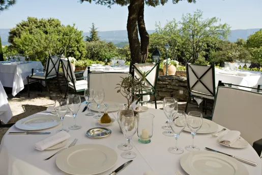tables on an outdoor patio with a view