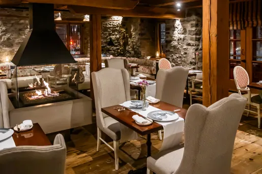 dining room with fireplace in the middle