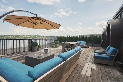 deck with patio furniture and umbrellas