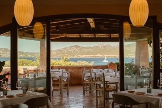 Dining area with a large, glass door leading to an outdoor patio