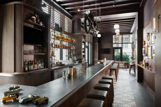 bar with motorcycle suspended above it