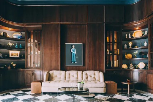 mahogany room with a couch and portrait