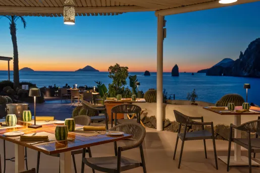 tables on patio overlooking sunset