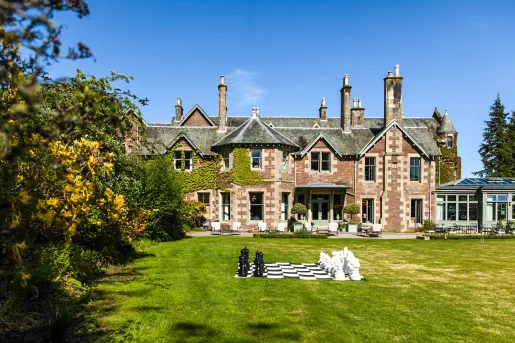 large stone house and expansive lawn