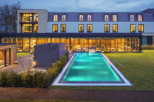 Large swimming pool outside of hotel