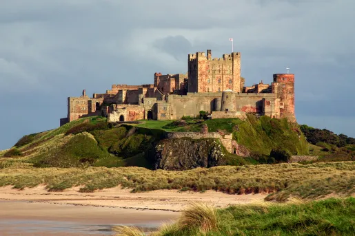 castle on a hill by a beach