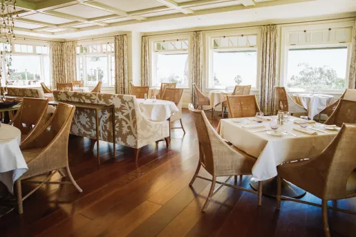 Dining hall with dining tables and brown chairs