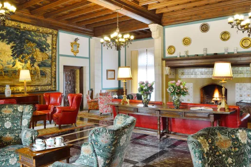 Lobby with red and white chairs and furniture and metal fixtures on the walls