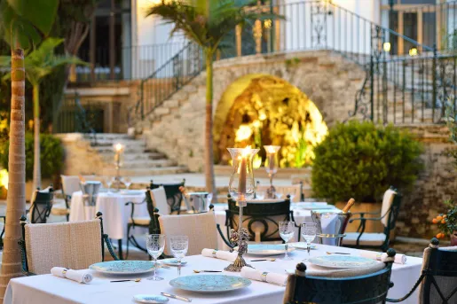 Outdoor dining area with a staircase in the background