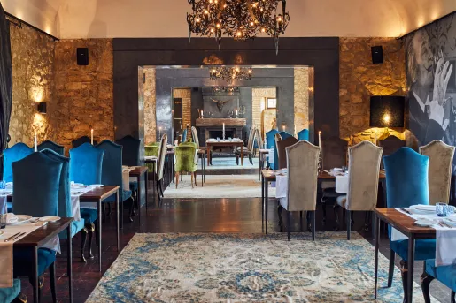 Indoor dining common area with blue and gray cushioned seats