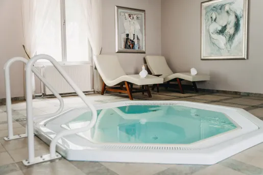 Hot tub next to lounge chairs