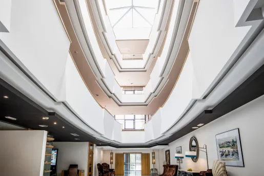 Open 4 story lobby with chairs and open walkways