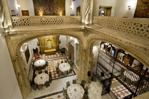 Two-story dining area with dining tables on the first floor