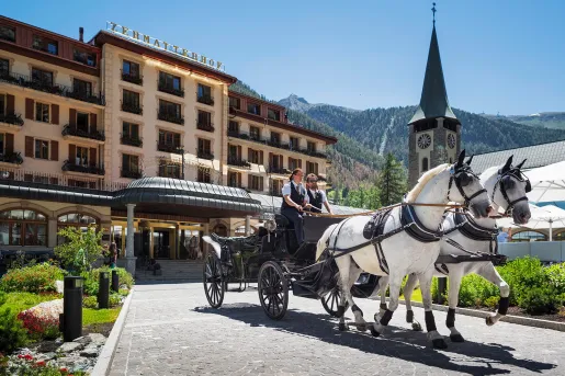 horse drawn carriage out front of hotel zermatterhof