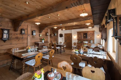 Indoor cabin dining hall, with antique clocks on the wall