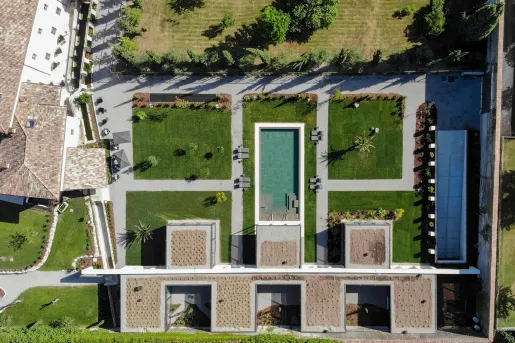 Top-down view of an outdoor courtyard with a pool