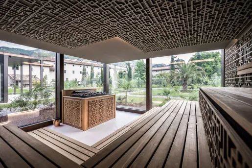Outdoor sauna with windows looking out to a courtyard
