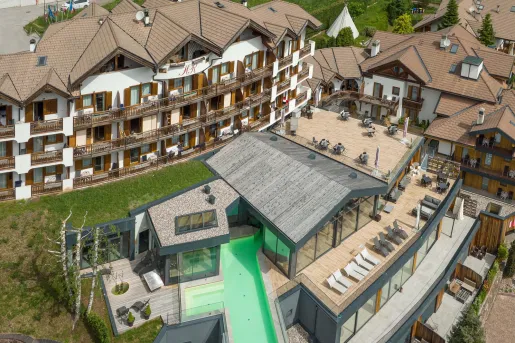 Top view of a hotel room with balconies and lawn chairs