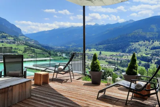 Outdoor, rooftop pool with pool chairs surrounding