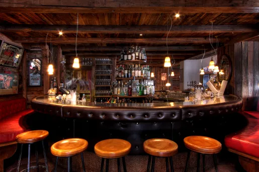 round hotel bar with barstools